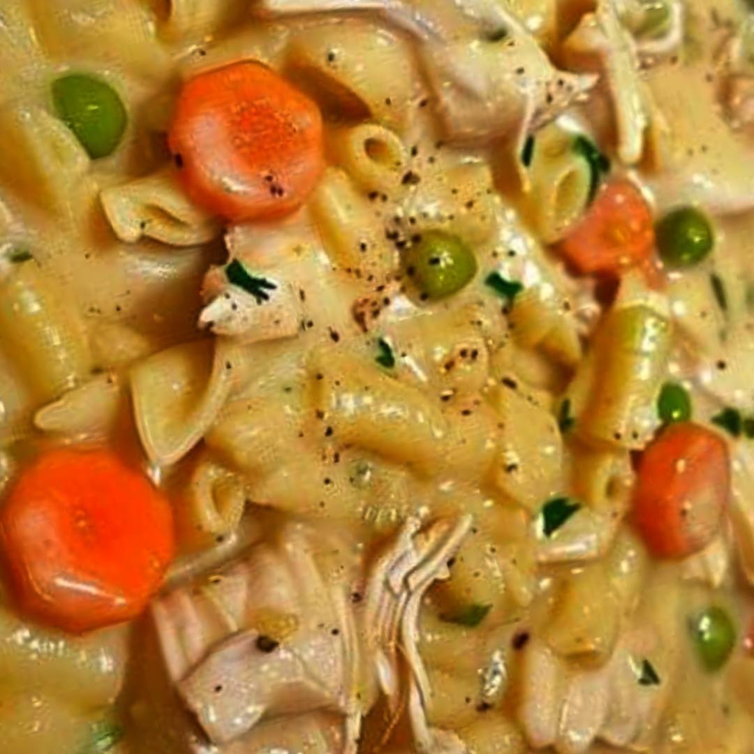 Skillet dish with chicken, noodles, and vegetables.